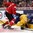 TORONTO, CANADA - DECEMBER 31: Switzerland's Michael Fora #2 knocks down Sweden's William Lagesson #3 during preliminary round action at the 2015 IIHF World Junior Championship. (Photo by Andre Ringuette/HHOF-IIHF Images)

